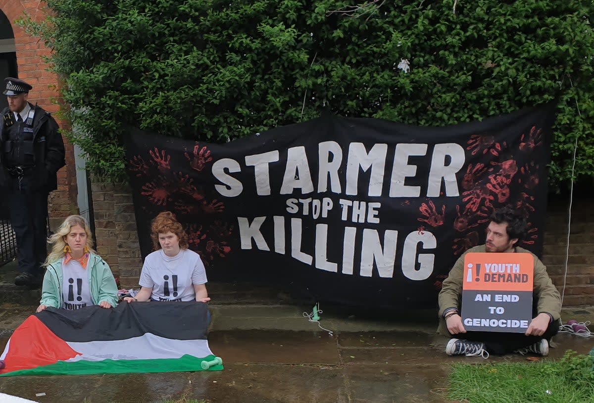 Demonstrators hung a banner outside Sir Keir’s house that read: “Starmer stop the killing” (Youth Demand/PA Wire)