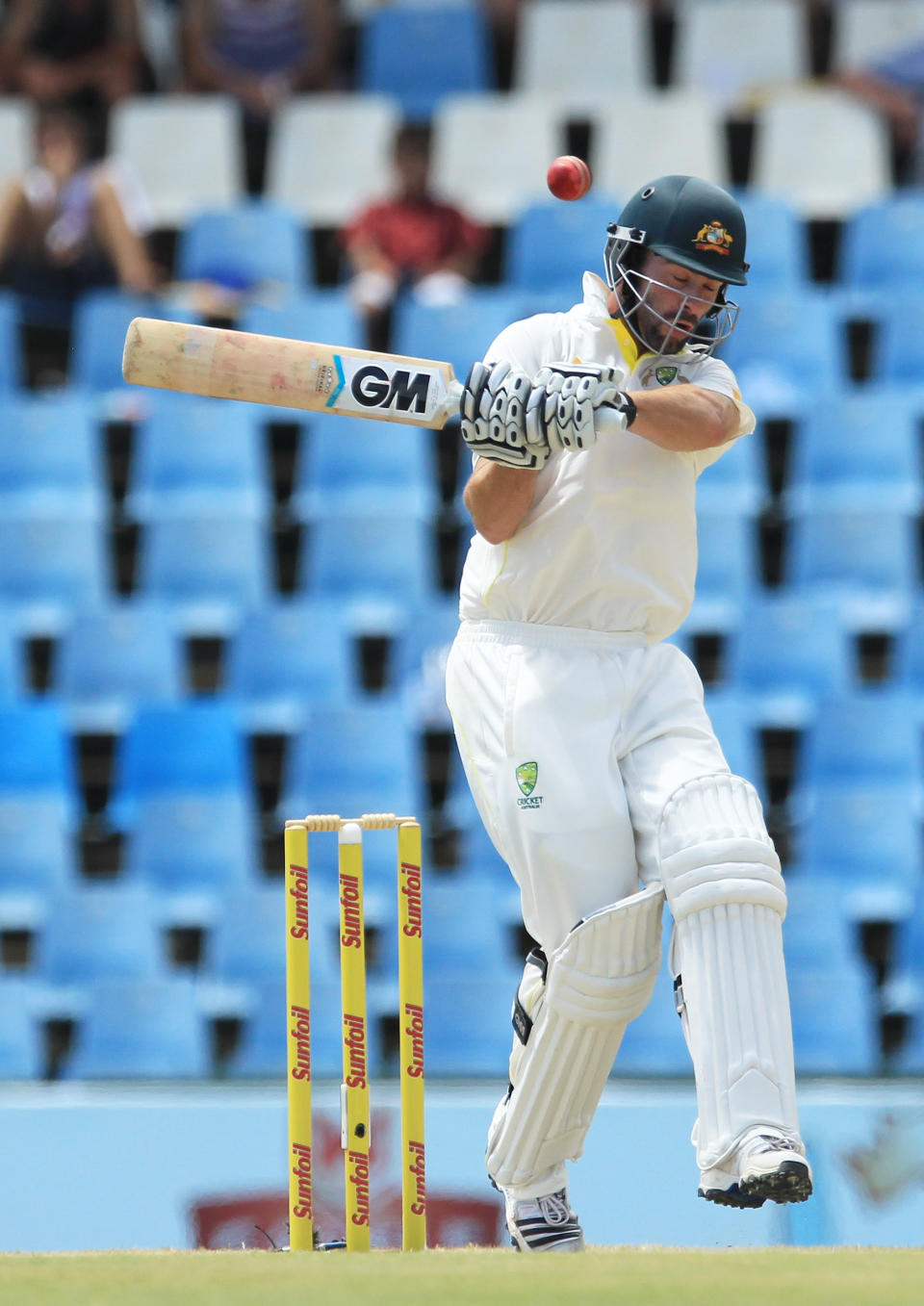 Australia's batsman Alex Doolan, takes evasive action against a bouncer on the third day of their their cricket test match against South Africa at Centurion Park in Pretoria, South Africa, Friday, Feb. 14, 2014. (AP Photo/ Themba Hadebe)