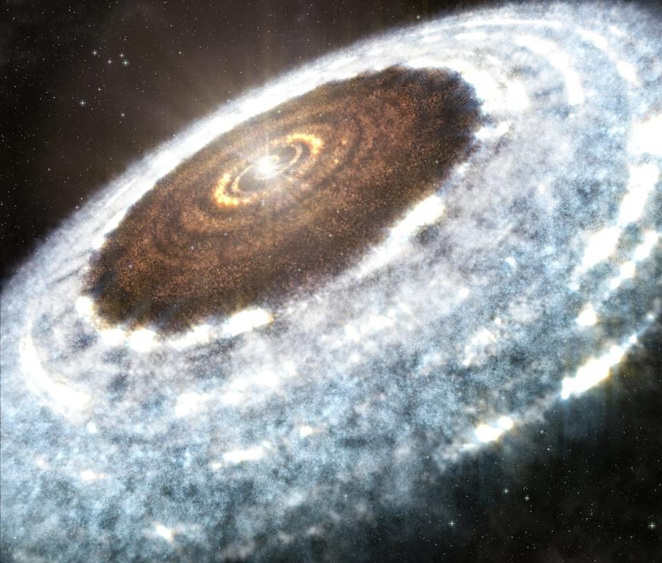 An artist's illustration shows the water snow line spotted around the young star V883 Orionis — the delineation between where the hot star vaporizes all water, leaving rocky dust and debris, and where ice and snow exist in the disk. <cite>A. Angelich (NRAO/AUI/NSF)/ALMA (ESO/NAOJ/NRAO)</cite>