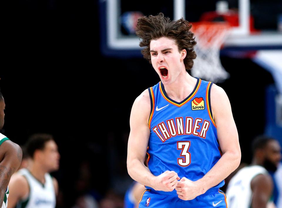 Oklahoma City's Josh Giddey (3) celebrates a 3-point basket in the second half during the NBA basketball game between the Oklahoma City Thunder and the Dallas Mavericks at the Paycom Center in Oklahoma City, Sunday, Jan. 2, 2022.