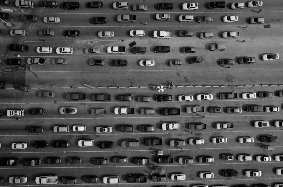 Lanes of cars line up along the U.S.-Mexico border at the port of entry at San Ysidro, California and Tijuana, Baja California. The port is the largest land border crossing point in the world.