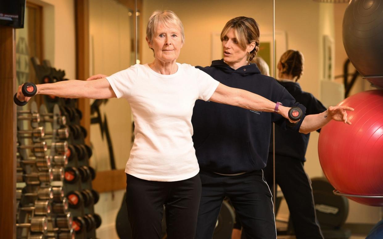 Elizabeth Kelly helps resident Gill try a new exercise  - Â©RUSSELL SACH - 0771 882 6138 - russell.sach@btinternet.com