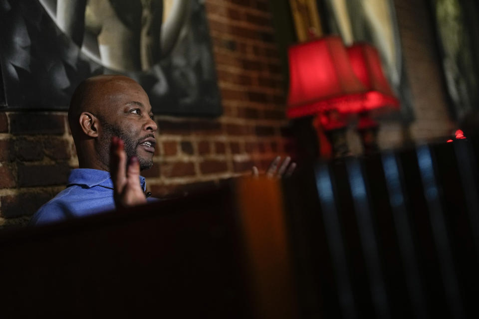 Laddie Howard, who owns a business making handcrafted leather goods speaks during an interview at Goat's Restaurant and Tavern on Tuesday, May 2, 2023, in Columbia, S.C. (AP Photo/Chris Carlson)