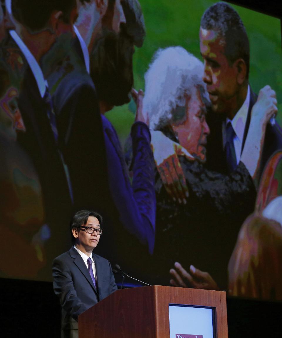 Charles Dharapak, the chief White House photographer for The Associated Press, projects one of his AP photographs of President Barack Obama while speaking to editors and publishers at the Newspaper Association of America’s mediaXchange 2014 convention, in Denver, Tuesday, March 18, 2014. Dharapak talked about his experience of ongoing coverage limitations placed on news organizations by the Obama White House. (AP Photo/Brennan Linsley)