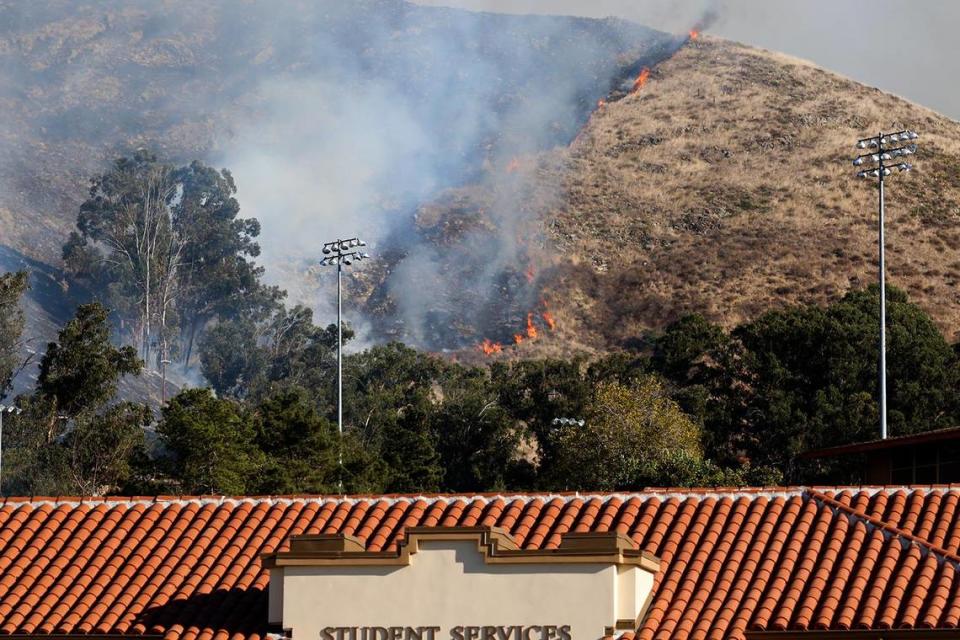 A fire burns the hillside off Lizzie Street behind San Luis Obispo High School on Monday, Oct. 30, 2023.