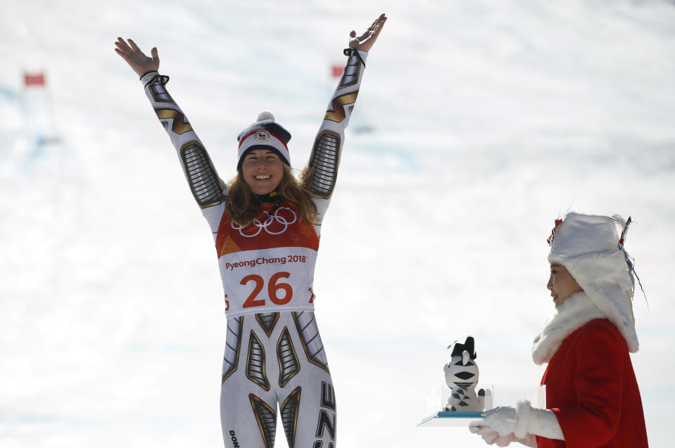 Gold medal winner Ester Ledecka, of the Czech Republic, celebrates during the flower ceremony after the women’s super-G at the 2018 Winter Olympics in Jeongseon, South Korea, Saturday, Feb. 17, 2018. (AP Photo)