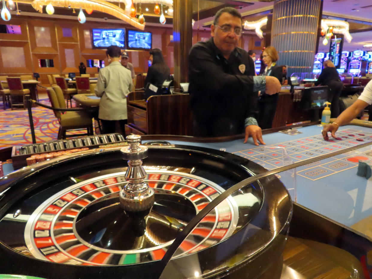 A dealer conducts a game of roulette at the Hard Rock Casino in Atlantic City, N.J., on Aug. 8, 2022. Figures released on Nov. 9, 2022, by the American Gaming Association show the U.S. commercial casino industry had its best quarter ever, winning over $15 billion from gamblers in the third quarter of this year. (AP Photo/Wayne Parry)