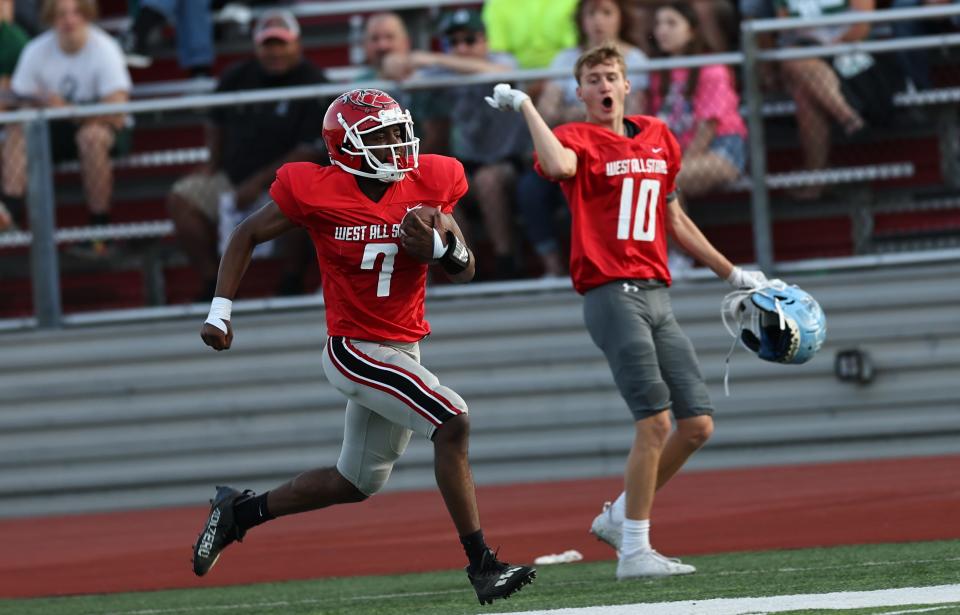 West running back Tayquan Calloway runs for a touchdown during the East vs. West All-Star football game at Dixie Heights High School, Thursday, June 9, 2022.
