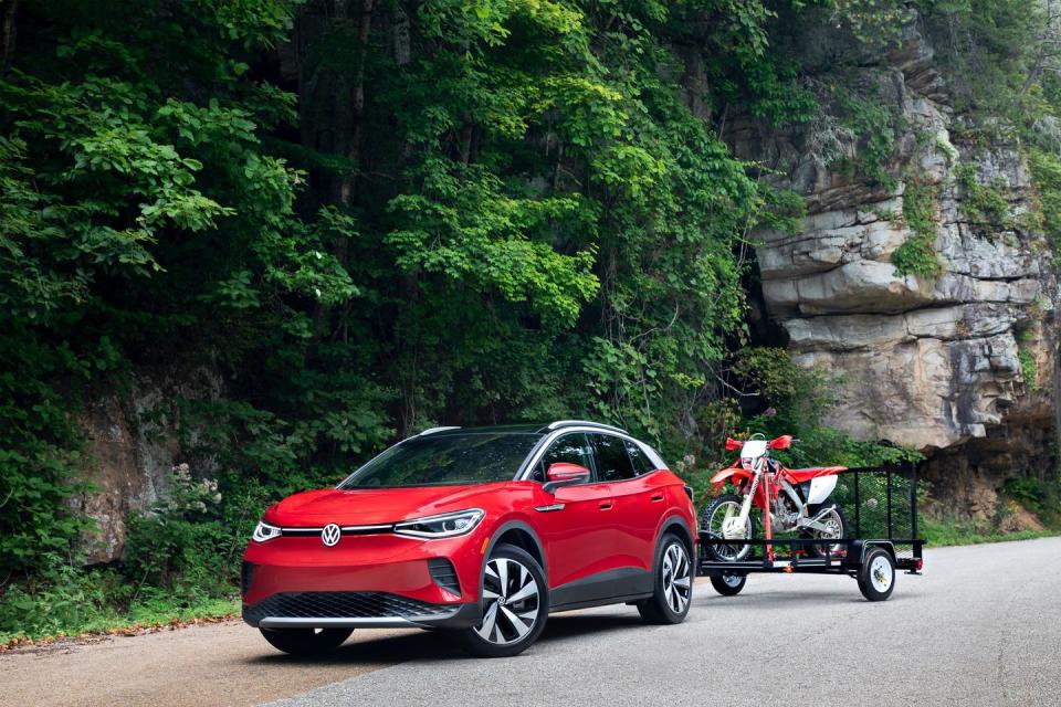 <p>Think of the 2022 Volkswagen ID.4 as the spiritual successor to the <a href="https://www.caranddriver.com/features/g15378761/volkswagen-beetle-models-by-year/" rel="nofollow noopener" target="_blank" data-ylk="slk:original Type 1 Beetle;elm:context_link;itc:0;sec:content-canvas" class="link ">original Type 1 Beetle</a>, but with an emissions-free twist. The base version of Volkswagen's first electric car even has its single electric motor mounted in the rear; <a href="https://www.caranddriver.com/reviews/a37536279/2021-volkswagen-id4-pro-s-awd-by-the-numbers/" rel="nofollow noopener" target="_blank" data-ylk="slk:all-wheel drive is optional;elm:context_link;itc:0;sec:content-canvas" class="link ">all-wheel drive is optional</a>, though, and opting for that puts a second motor in the front. Driving range is decent at up to 260 miles per charge and with DC fast-charging, the battery can be replenished quickly via public charging stations. While it lacks the driving verve that we appreciate in <a href="https://www.caranddriver.com/volkswagen" rel="nofollow noopener" target="_blank" data-ylk="slk:other VW models;elm:context_link;itc:0;sec:content-canvas" class="link ">other VW models</a>, the ID.4's interior is quiet and relaxed when cruising. The ID.4's almost entirely digital dashboard gives the interior a high-tech aesthetic, but it takes some getting used to, particularly the infotainment system that features quirks that may frustrate some users. Even so, the ID.4 represents a solid value and because of that we've made room for it on our annual <a href="https://www.caranddriver.com/features/a38873223/2022-editors-choice/" rel="nofollow noopener" target="_blank" data-ylk="slk:Editors' Choice list;elm:context_link;itc:0;sec:content-canvas" class="link ">Editors' Choice list</a>.</p><p><a class="link " href="https://www.caranddriver.com/volkswagen/id4-2022" rel="nofollow noopener" target="_blank" data-ylk="slk:Review, Pricing, and Specs;elm:context_link;itc:0;sec:content-canvas">Review, Pricing, and Specs</a></p>