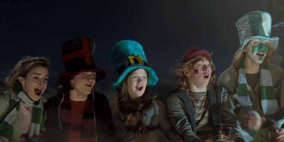 hermione, harry, ginny, ron, fred, and george at the quidditch world cup in harry potter and the goblet of fire