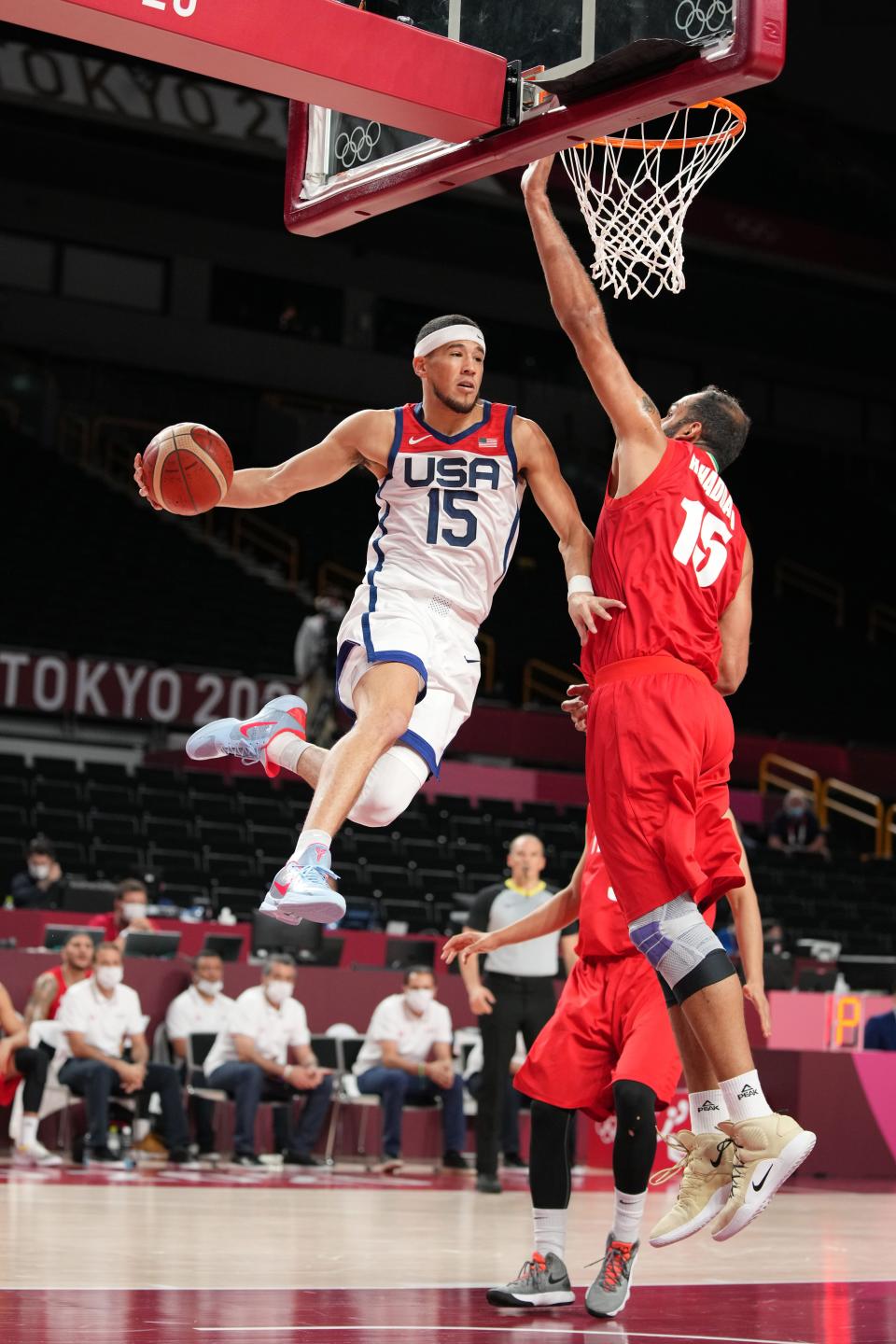 Devin Booker (15) goes up against Iran player Hamed Haddadi at Saitama Super Arena.