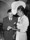 <p>Josephine Baker watches as her soon-to-be husband, Jo Bouillon, places a wedding band on her finger. The couple married in 1947 in the chapel at Baker's French home, Château des Milandes. </p>