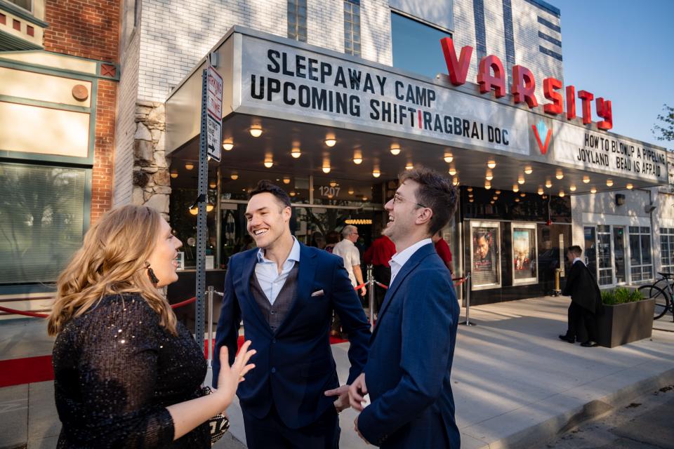 Co-Director Kelsey Kremer talks with cast members Ian Zahren and Andrew Boddicker before the premiere of "Shift: The RAGBRAI Documentary" to sold-out crowd at Varsity Cinema, Thursday, May 4, 2023.