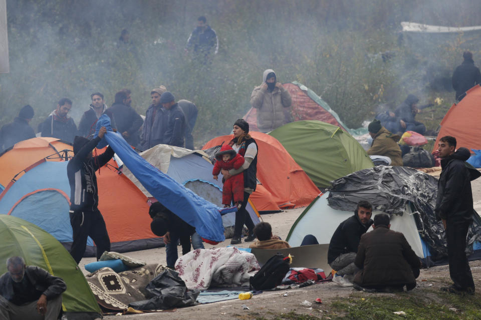 Migrant people after they spent third night at the border crossing in Maljevac, Bosnia, Friday, Oct. 26, 2018. About 150 people have gathered at the border between Bosnia and Croatia, hoping for the European border to open for people fleeing war and poverty. (AP Photo/Amel Emric)