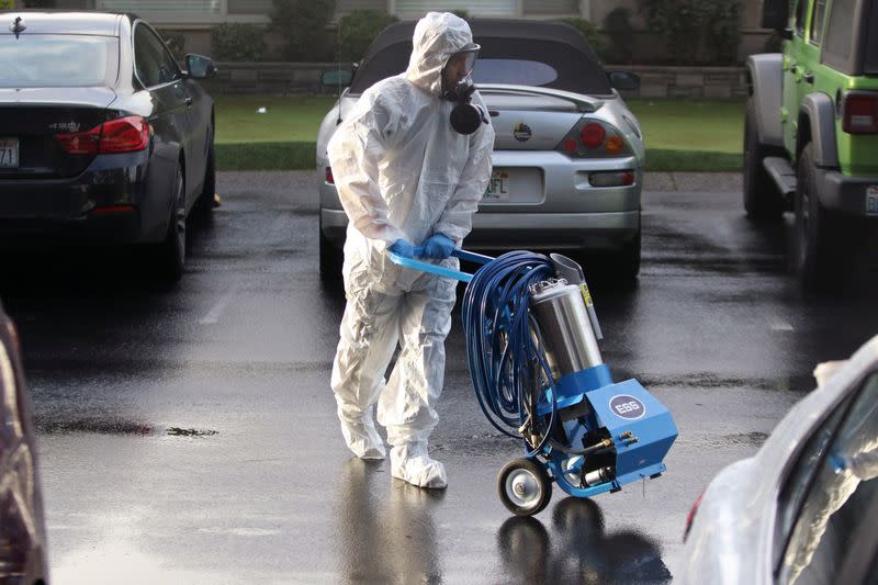 A member of a Servpro cleanup crew prepares to enter Life Care Center of Kirkland, the Seattle-area nursing home at the epicenter of one of the biggest coronavirus outbreaks in the United States, in Kirkland