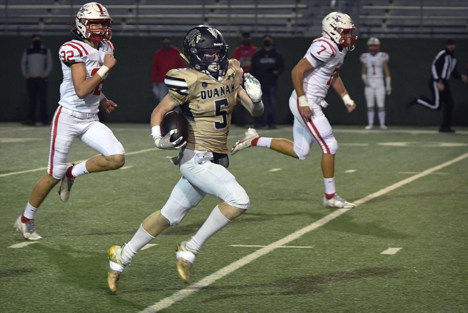 Quanah's Brennan Thomas (5) took the opening kickoff across midfield in Thursday's playoff game against Muenster at Memorial Stadium.