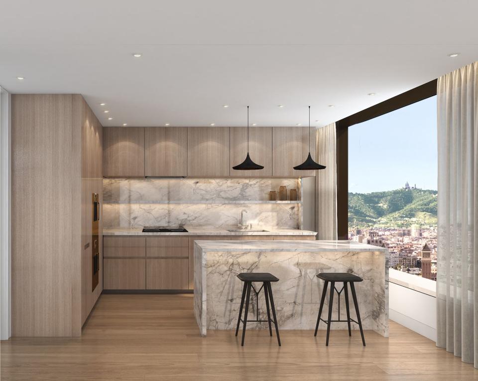 A sleek kitchen at the Mandarin Oriental Residences, Barcelona, overlooking the city.