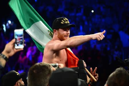 Sep 15, 2018; Las Vegas, NV, USA; Canelo Alvarez celebrates after defeating Gennady Golovkin (not pictured) in the middleweight world championship boxing match at T-Mobile Arena. Alvarez won via majority decision. Mandatory Credit: Joe Camporeale-USA TODAY Sports