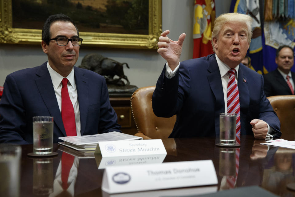 Treasury Secretary Steve Mnuchin listens as President Donald Trump speaks during a meeting on tax policy with business leaders in the Roosevelt Room of the White House, Tuesday, Oct. 31, 2017, in Washington. (AP Photo/Evan Vucci)