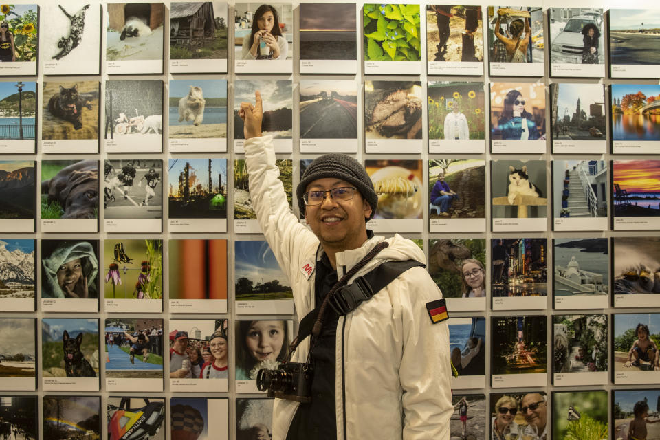 Photographer Johnny L. points toward his photo selected to be in the exhibit. (Photo: Gordon Donovan/Yahoo News) 