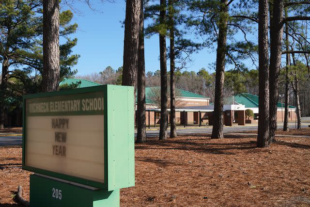 <p>Jay Paul/Getty Images</p> A school sign outside Richneck Elementary School on January 7, 2023 in Newport News, Virginia