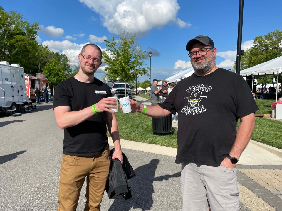 William Grzybowski and Jaron Parsons offer cheers to a great day at the Southern Tequila and Taco Fest to benefit Remote Area Medical at Mayor Ralph McGill Plaza on April 28, 2023.