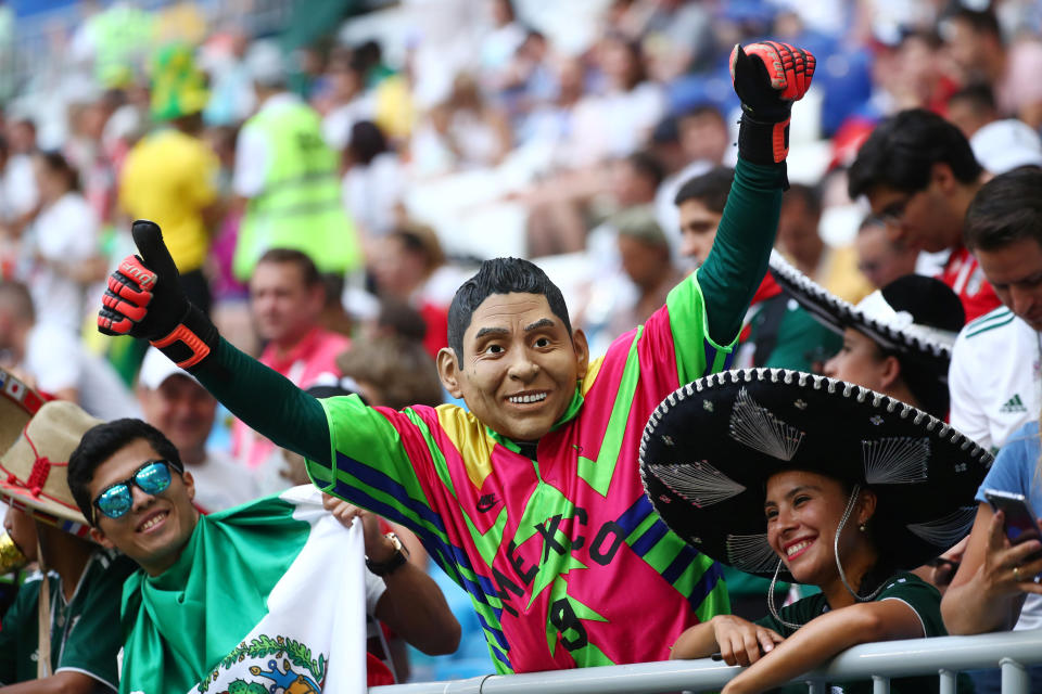 <p>Mexico fan wearing a mask inside the stadium before the match REUTERS/Pilar Olivares </p>