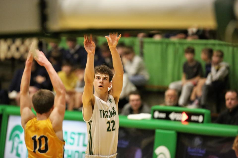 New Castle boys basketball's Gavin Welch takes a jumper in the team's sectional championship game against Delta at the New Castle Fieldhouse on Saturday, March 4, 2023.