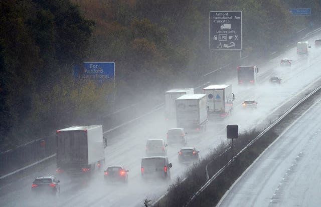 Cars drive in rain