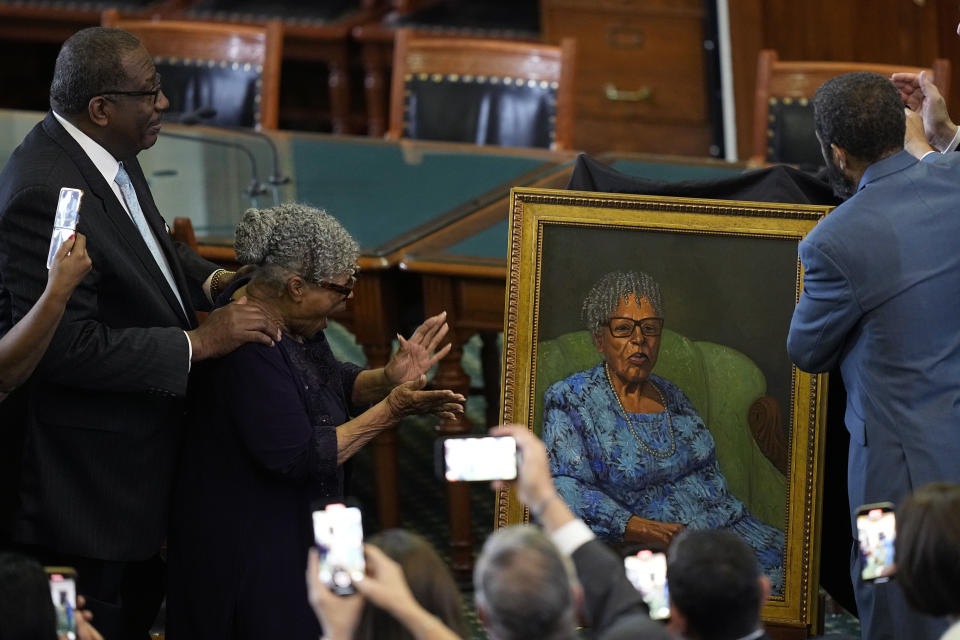 Opal Lee, who worked to help make Juneteenth a federally-recognized holiday, second from left, stands with state Sen. Royce West, left, as her portrait is unveiled in the Texas Senate Chamber, Wednesday, Feb. 8, 2023, in Austin, Texas. (AP Photo/Eric Gay)