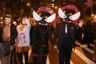 <p>People wear creepy cat-eye costumes at the 44th annual Village Halloween Parade in New York City on Oct. 31, 2017. (Photo: Gordon Donovan/Yahoo News) </p>