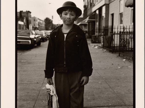 a child dressed as a homeless man in black and white