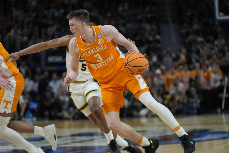 FILE - Tennessee guard Dalton Knecht (3) drives as Purdue guard Myles Colvin (5) defends during the first half of an Elite Eight college basketball game in the men's NCAA Tournament, March 31, 2024, in Detroit. Knecht is among the headliners of the guards in the upcoming NBA draft. (AP Photo/Paul Sancya., File)