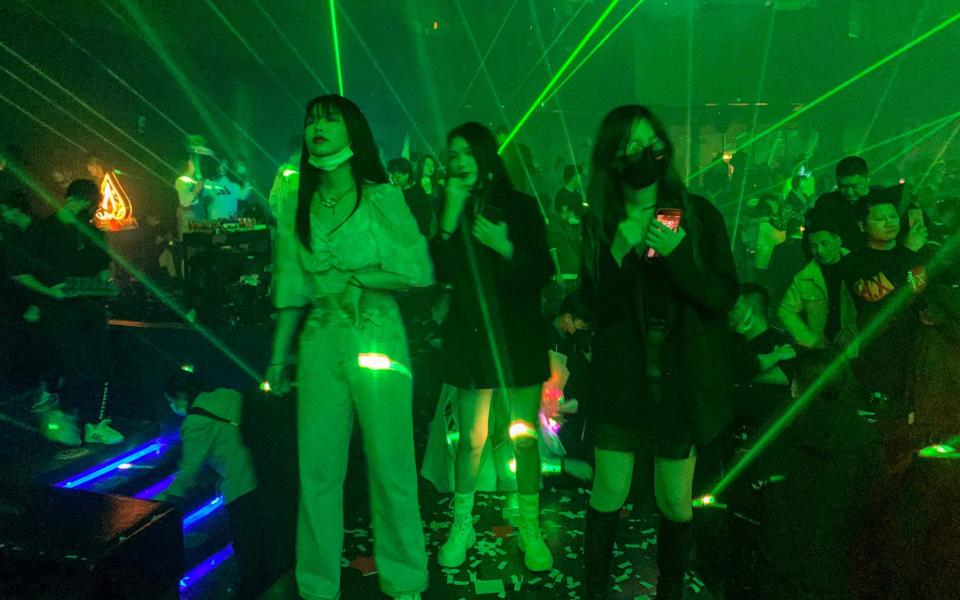 People visit a nightclub in Wuhan on January 21