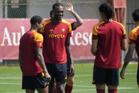 Roma's Tammy Abraham talks with his teammates before training during a media day, ahead of the Europa League soccer final, at the Trigoria training centre, in Rome, Thursday, May 25, 2023. Roma will play an Europa League final against Sevilla in Budapest, Hungary, next Wednesday, May 31. (AP Photo/Andrew Medichini)