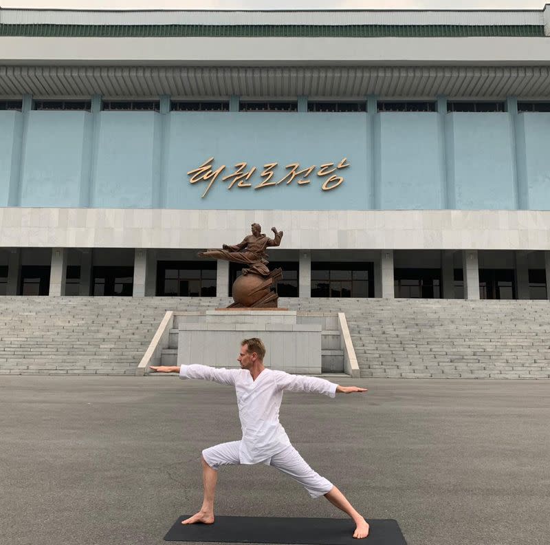 Swedish Ambassador Joachim Bergstrom practices yoga near the Taekwondo Palace in Pyongyang