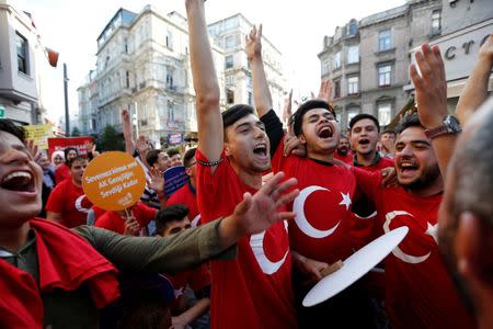 Supporters of Turkish President Tayyip Erdogan shout slogans during a pre-election gathering in Istanbul, Turkey, June 20, 2018. REUTERS/Huseyin Aldemir