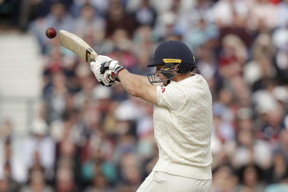 England's Jos Buttler hooks a six during the fifth cricket test match of a five match series between England and India at the Oval cricket ground in London, Saturday, Sept. 8, 2018. (AP Photo/Matt Dunham)