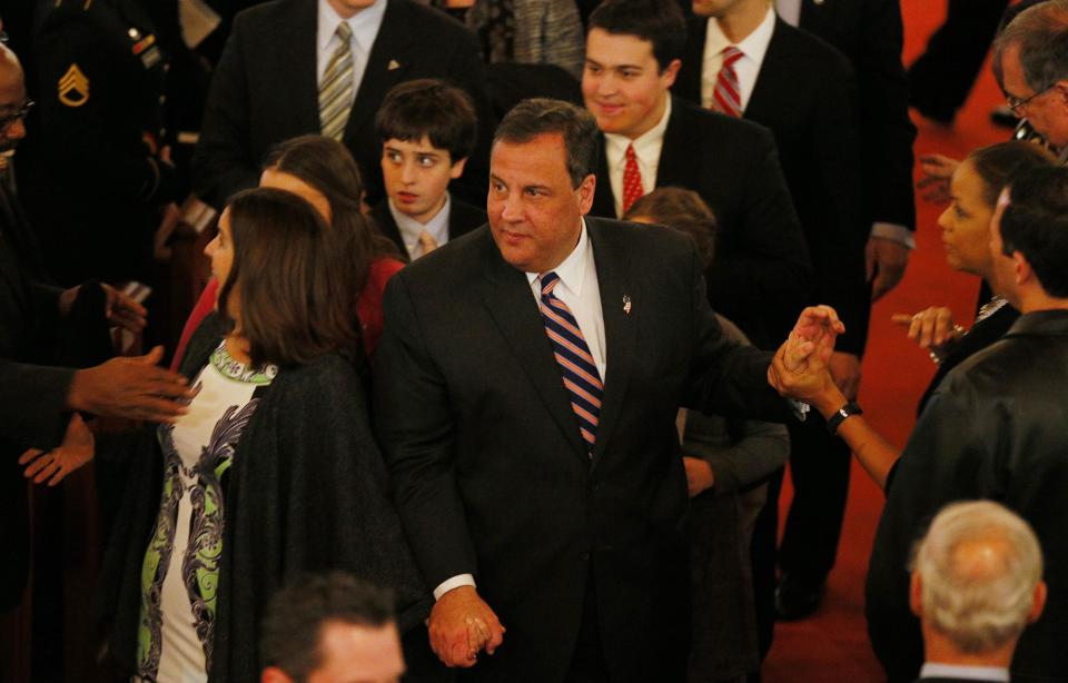 Governor Chris Christie leaves with his family after attending his inauguration service in Newark, New Jersey, January 21, 2014. Christie, a Republican Party star enmeshed in scandal after re-election in November, will return to the themes of small government and bipartisan cooperation when he is sworn in for a second term on Tuesday. Excerpts from Christie's inaugural address provided by the governor's office made no mention of the abuse of power accusations swirling around some of his closest aides. Instead, the speech criticized the idea that an "almighty government" can "fix any problem." (REUTERS/Adam Hunger)
