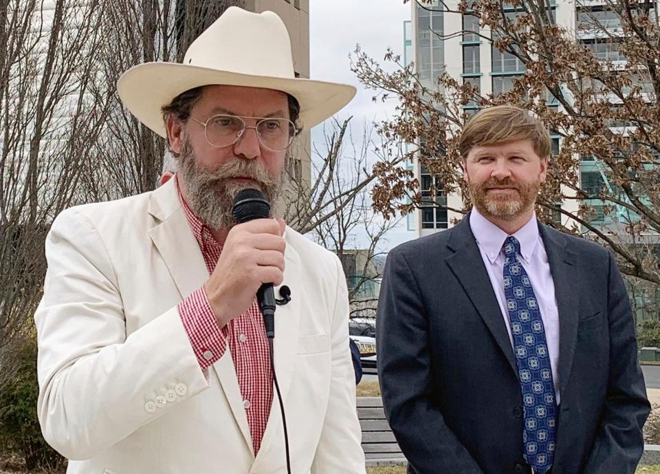 Proud Boys founder Gavin McInnes, left, discusses a lawsuit he filed against the Southern Poverty Law Center during a news conference in Montgomery, Ala., on Monday, Feb. 4, 2019. His attorney, Baron Coleman, listens on the right. McInnes contends the nonprofit organization wrongly labeled the far-right Proud Boys a hate group. (AP Photo/Kim Chandler) ORG XMIT: ALKC101