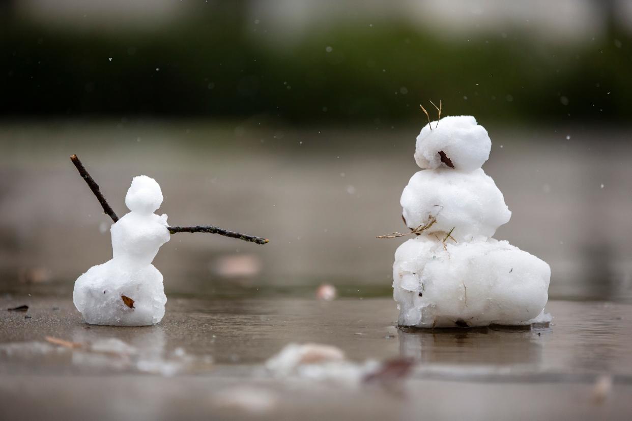 Two snowmen slowly melt on UGA’s campus during a snow day on Sunday, Jan. 16, 2022 in Athens.