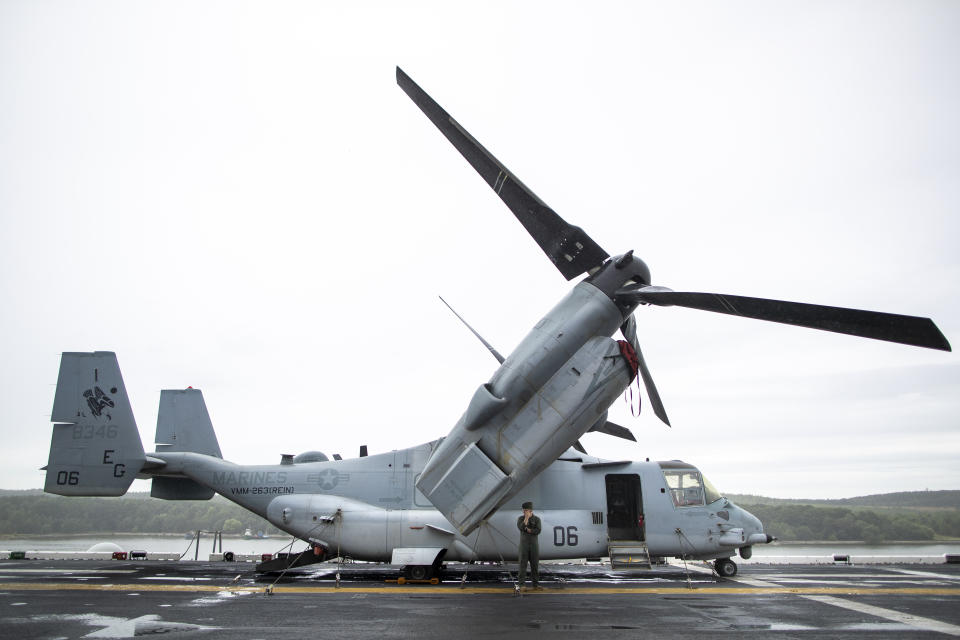 A helicopter is parked on the deck of the Wasp-class amphibious assault ship USS Kearsarge, during the ship's welcome ceremony at the seaport of Klaipeda, Lithuania, Monday, Aug. 22, 2022. The Wasp-class amphibious assault ship USS Kearsarge (LHD 3), flagship of the Kearsarge Amphibious Ready Group and 22nd Marine Expeditionary Unit, arrived in Klaipeda, Lithuania for a scheduled port visit, Aug. 20, 2022. The ship's presence in Lithuania builds on the strong and enduring relationship the United States shares with the Baltic country, showing NATO solidarity and unity. (AP Photo/Mindaugas Kulbis)