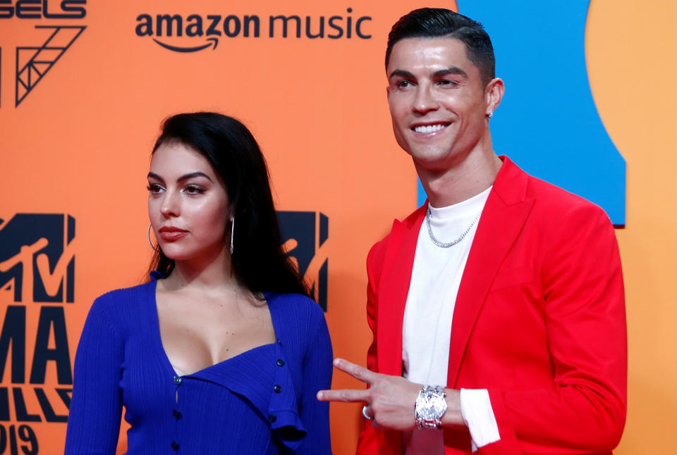 Cristiano Ronaldo and Georgina Rodriguez pose on a red carpet as they arrive at the 2019 MTV Europe Music Awards at the FIBES Conference and Exhibition Centre in Seville, Spain, November 3, 2019. REUTERS/Jon Nazca