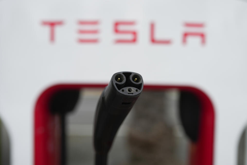 Tesla's EV charging connector is pictured at a charging station in Anaheim, Calif., Friday, June 9, 2023. Owners of General Motors and Ford electric vehicles will be able charge at many of Tesla's large network of stations across the U.S. starting next year. (AP Photo/Jae C. Hong)