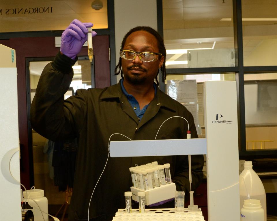 Chemist Justin Copeland analyzes a sample in the Portsmouth Naval Shipyard's Material Test Lab.