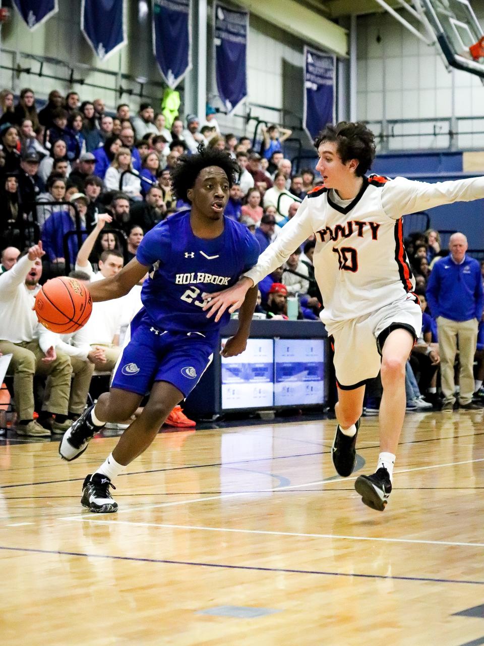 Holbrook's Armani Perkins drives to the basket during the Div. 5 Final Four game against David Prouty at Framingham High on Wednesday, March 15, 2023.