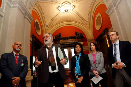 Director of Global Bersih Bala Chelliah, Swiss National Councillor Carlo Sommaruga, Director of Center to Combat Corruption and Cronyism Cynthia Gabriel and Director of Bruno Manser Fund Lukas Straumann attend a news conference at the Swiss Parliament Building (Bundeshaus) in Bern, Switzerland March 13, 2018. REUTERS/Stefan Wermuth