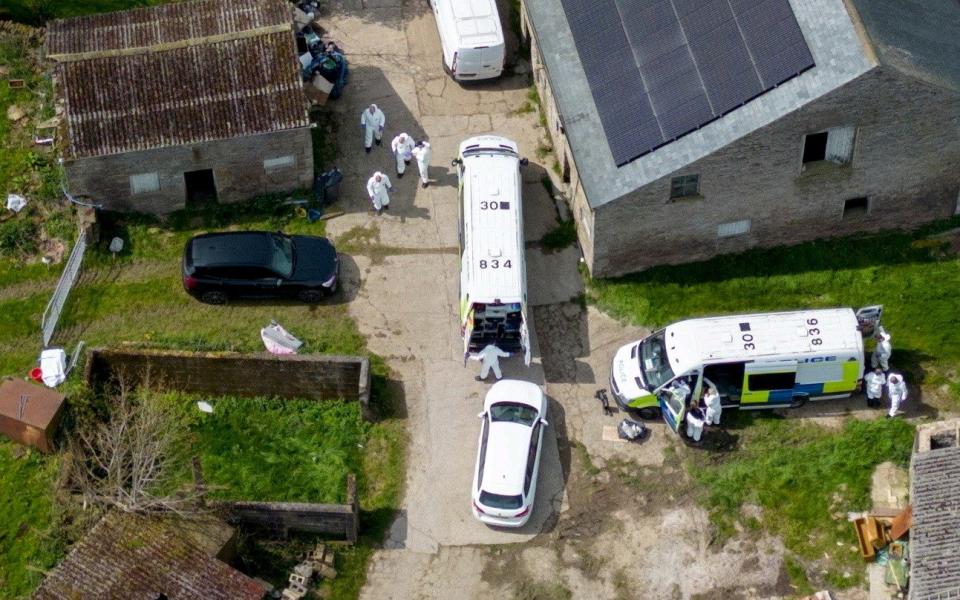 Forensic officers at the farm property in Whaley Bridge, Derbyshire
