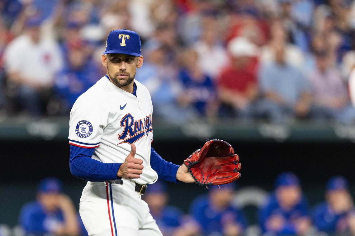 Rangers pitcher Nathan Eovaldi (17) signals he is okay after being hit by a comeback pitch in the first inning during the Texas Rangers season opener against the Chicago Cubs at Globe Life Field on Thursday, March 28, 2024.