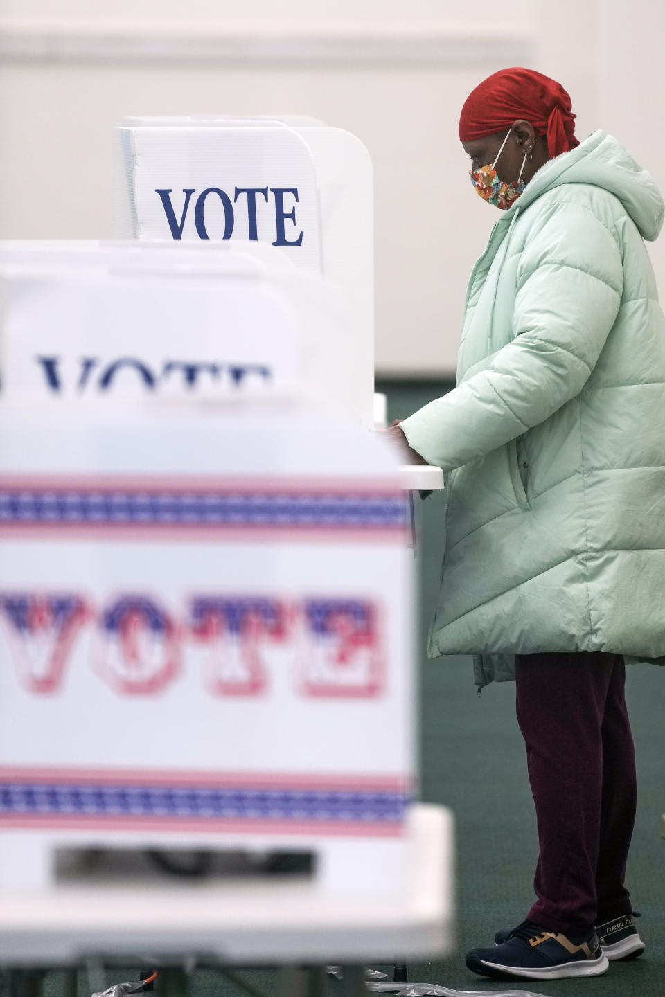 A voter casts an early ballot at a polling station Thursday, Feb. 9, 2023, in Milwaukee. Recent revelations about Republican election strategies targeting minority communities in Wisconsin’s biggest city came as no surprise to many Black voters. For years, voting rights advocates have accused Wisconsin Republicans of pushing policies to suppress voters of color and lower-income voters. Many of those policies centered on the Democratic stronghold of Milwaukee. (AP Photo/Morry Gash)